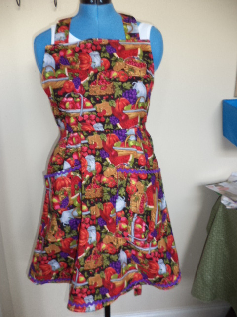 Bright Fruit pattern full apron with purple rick rack trim and red lining