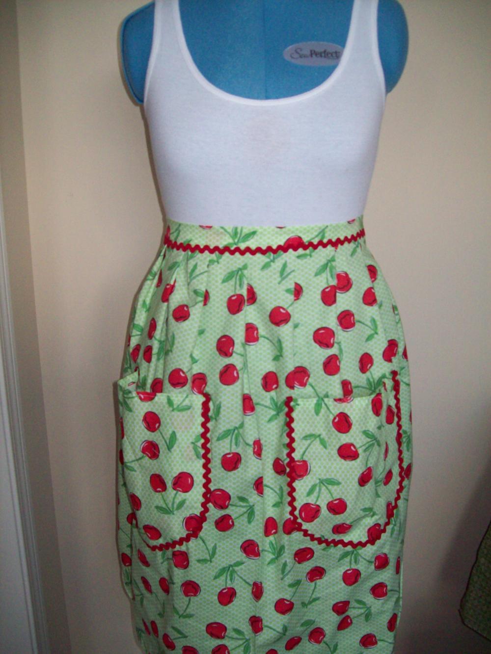 Handmade Bright Cherry Pattern Half Apron with green lining and red rick rack accents